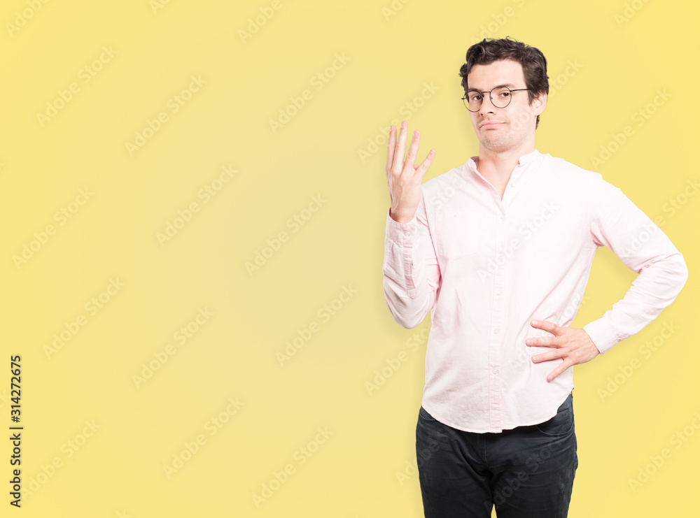 Young man making a number four gesture Young man making a number four gesture
