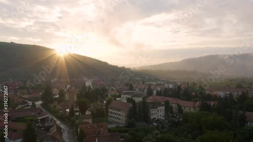 4k Sighisoara Romania Aerial Footage Drone Sunset Transylvania Church on Hill photo