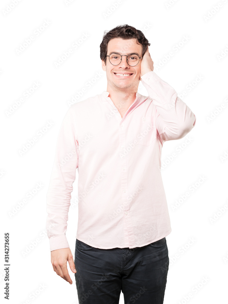 Young man worried about loud noises and covering his ears Young man worried about loud noises and covering his ears