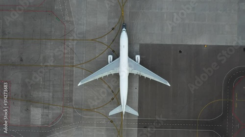airfield. Aircraft towing. Preparing the plane for flight. Airport technical services. Airplane Service. Airbus A330 top view. Aerial view. airplane Unnamed, Pure white fezulage of an airplane.