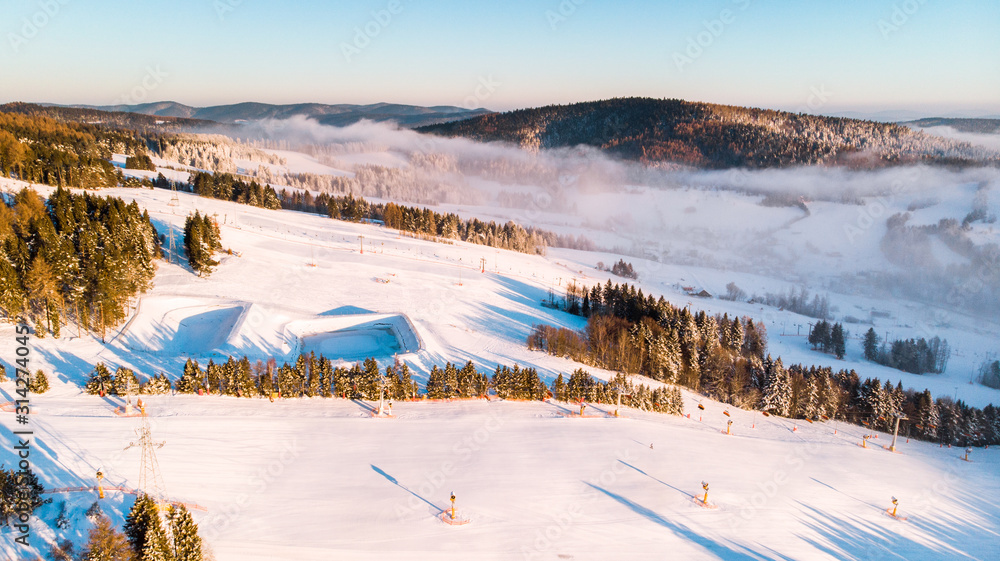 Slotwina Ski Lift near Krynica in Poland at Sunrise in Winter Season. Aerial Drone View