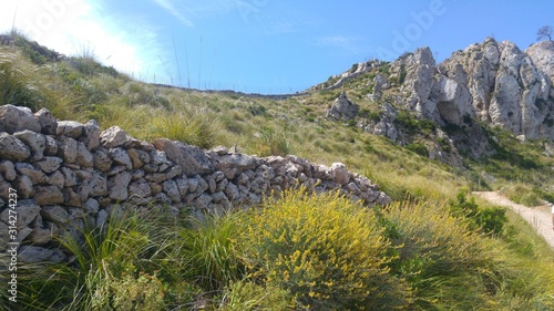 natural stone wall on the edge of the path