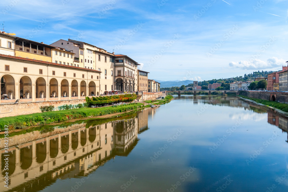 View of stone bridge over Arno river in Florence, Tuscany, Italy.