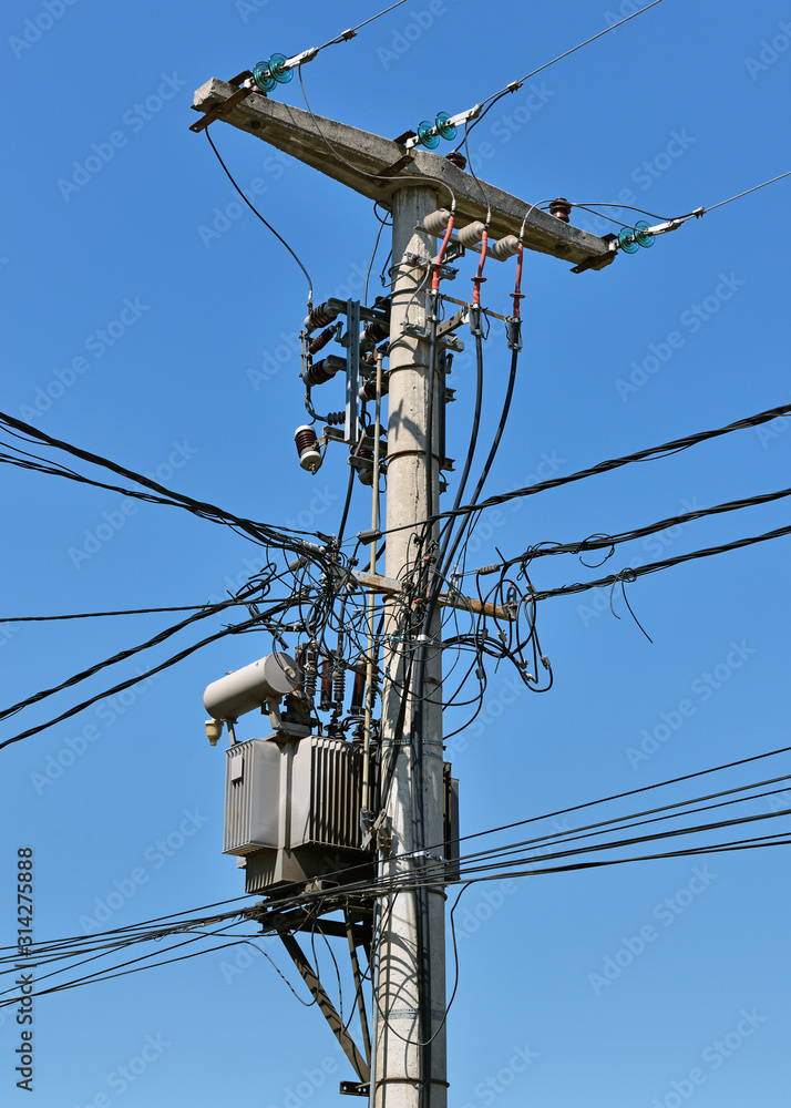 Utility Pole with Overhead Power Lines and a Transformer Utility Pole with Overhead Power Lines and a Transformer