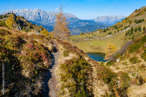 Autumn alpine Grosser Paarsee or Paarseen lake, Land Salzburg, Austria. Alps Hochkonig rocky mountain group view in far. photo