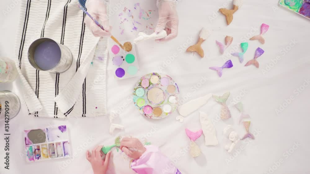 Flat lay. Step by step. Painting mermaid tails and seashells with acrylic paint to decorate Halloween pumpkins. Flat lay. Step by step. Painting mermaid tails and seashells with acrylic paint to decorate Halloween pumpkins.