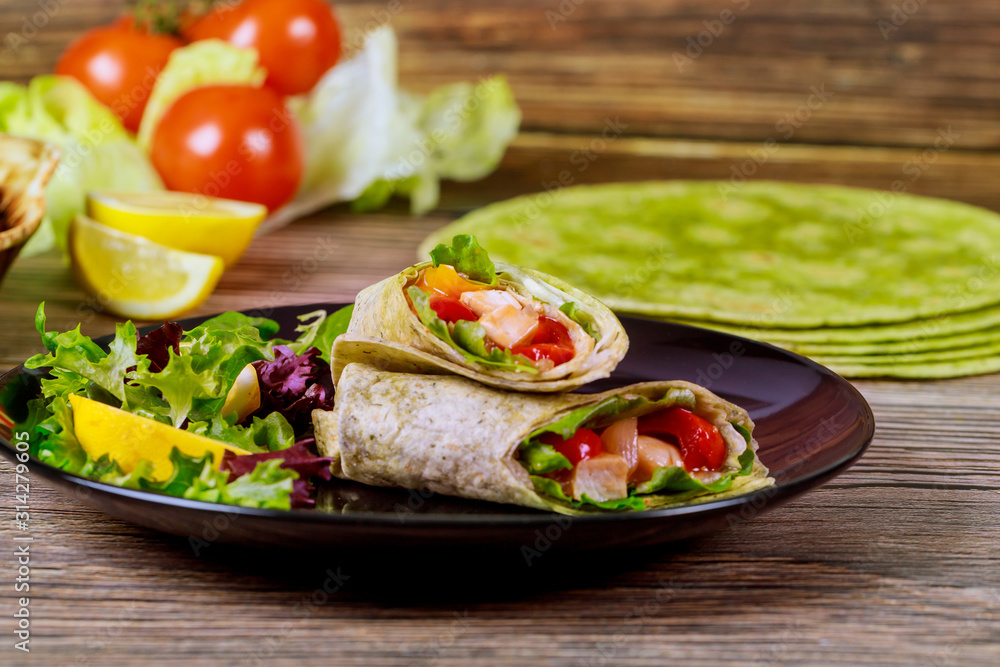 Wrap with meat and vegetable made from spinach tortillas. Wrap with meat and vegetable made from spinach tortillas.