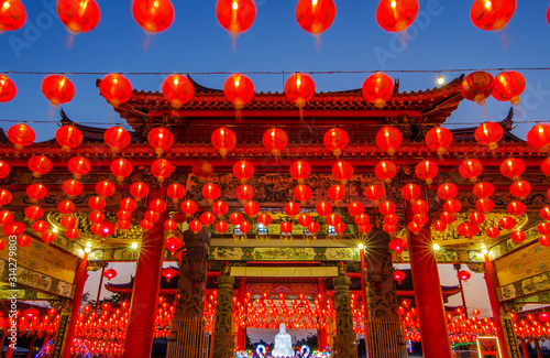 Traditional chinese lantern on display in a Chinese temple at night for the chiniese new year festival photo