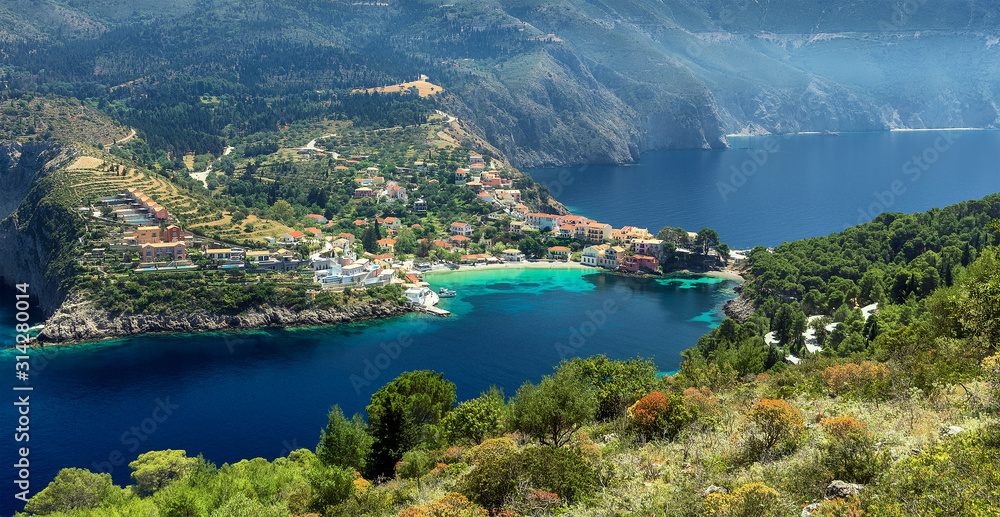 Wonderful summer seascape of Ionian Sea. Wonderful place for holiday. Amazing Greece. Picturesque colorful village Assos in Kefalonia. Turquoise colored bay in Mediterranean sea. Aerial view. panorama