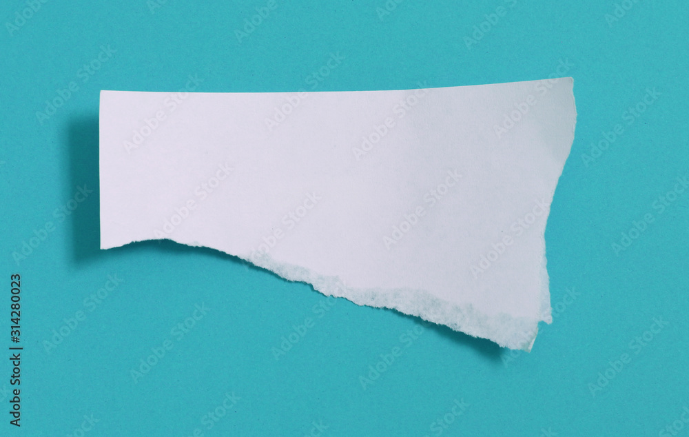 torn paper on blue background with copy space for text torn paper on blue background with copy space for text