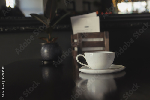 Coffee cup in coffee shop - vintage style effect picture