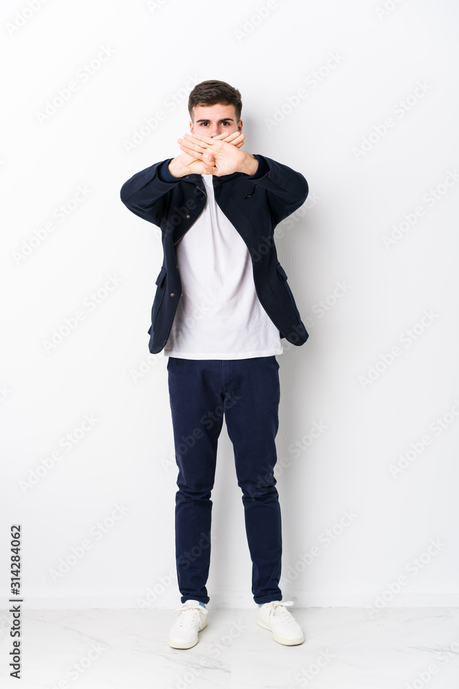 Full body young caucasian man isolated doing a denial gesture Full body young caucasian man isolated doing a denial gesture