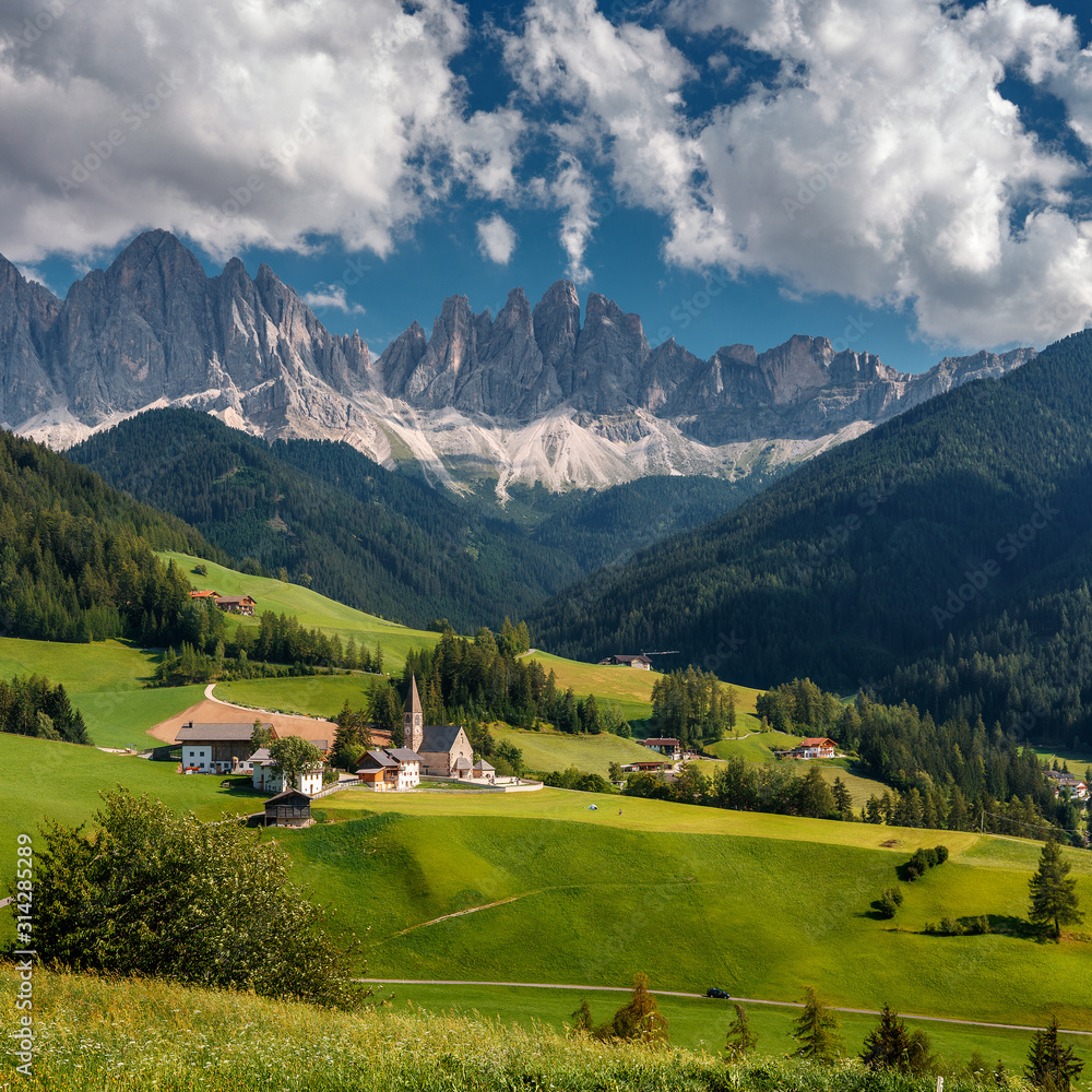 Wonderful Sunny Landscape of Dolomites Alps. Scenic Imege of Alpine Valley With Majestic Rocky Mountains peaks and perfect sky, Beautiful View on Famouse place Santa Maddalena, Dolomiti, Italy