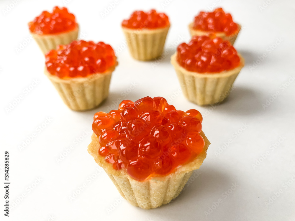 Tartlets with red salmon caviar. Snack, delicacy Tartlets with red salmon caviar. Snack, delicacy