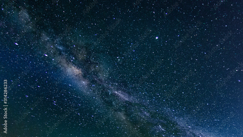 Fototapeta premium Milky way galaxy with stars and space in the universe background at thailand
