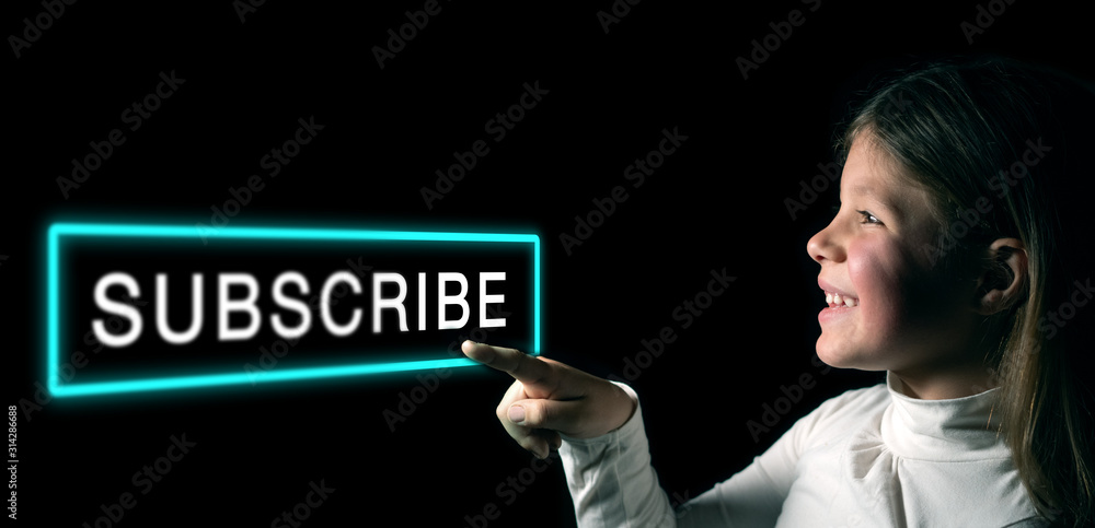 A little girl is touching an augmented reality a virtual hologram of word A little girl is touching an augmented reality a virtual hologram of word