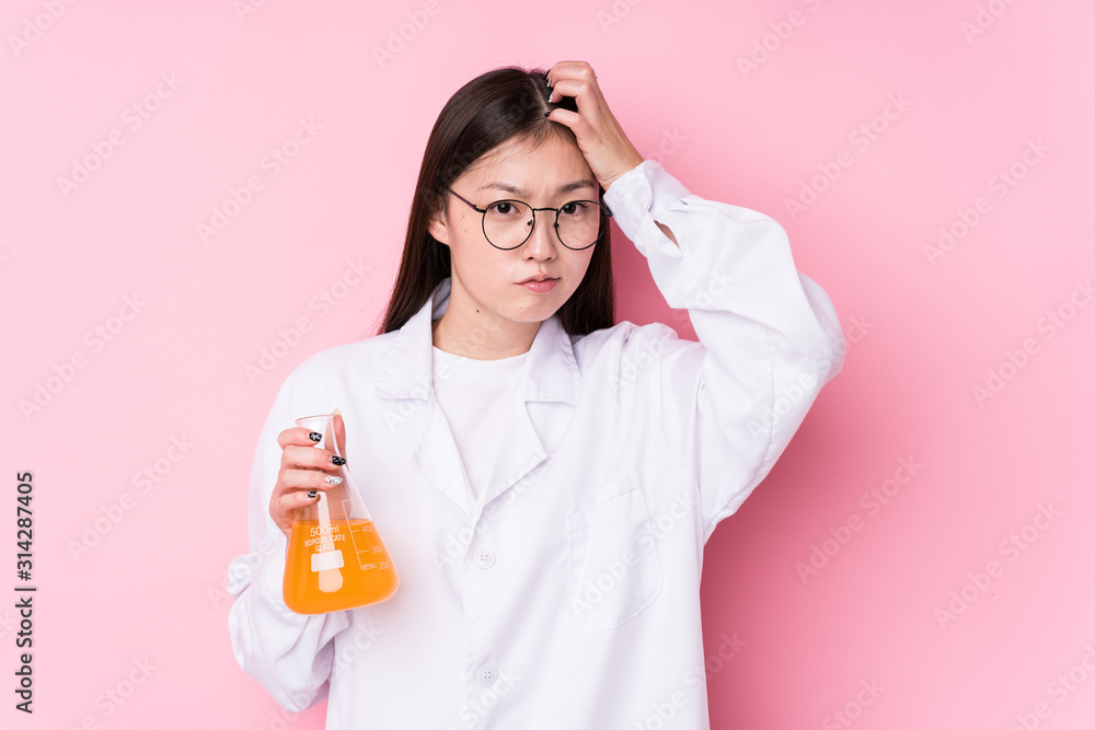 Young chinese scientific woman isolated being shocked, she has remembered important meeting. Young chinese scientific woman isolated being shocked, she has remembered important meeting.