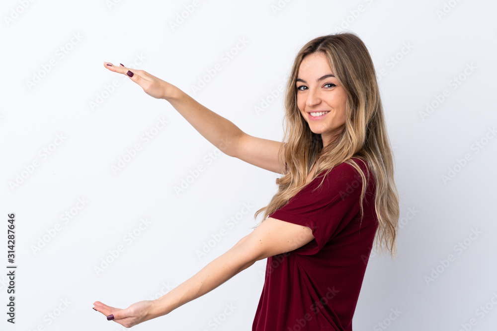 Young woman over isolated white background holding copyspace to insert an ad Young woman over isolated white background holding copyspace to insert an ad