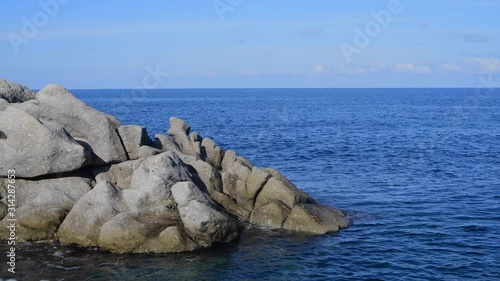 Coti Piane, the cliffs of Capo Sant'Andrea in Elba island, Tuscan Archipelago, Italy. Large granite massifs mixed with orthoclase crystals surrounded by beautiful sea water photo