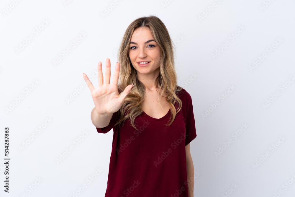 Young woman over isolated white background counting five with fingers Young woman over isolated white background counting five with fingers