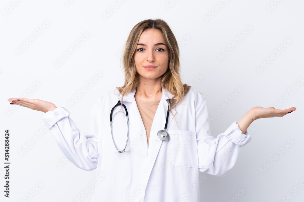 Young woman over isolated white background wearing a doctor gown and having doubts Young woman over isolated white background wearing a doctor gown and having doubts