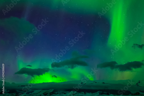 Aurora borealis in night northern sky. Ionization of air particl © Ludmila