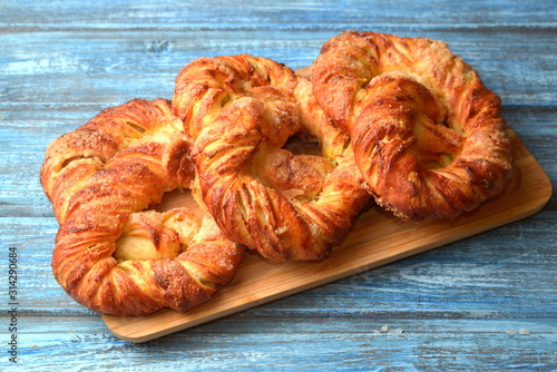 Fresh pastries bakery products, on wooden table