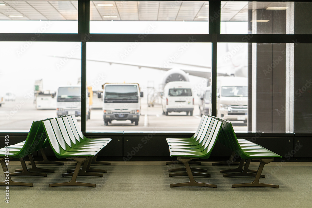 Chairs in modern airport terminal