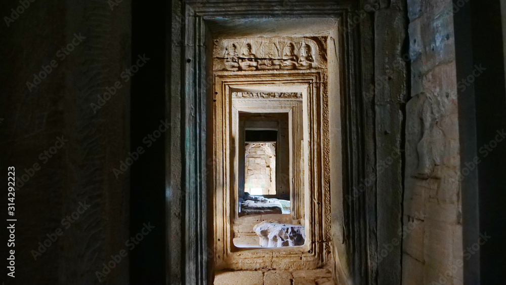 Stone rock door interior decoration in Bayon Temple in Angkor wat complex, Siem Reap Cambodia