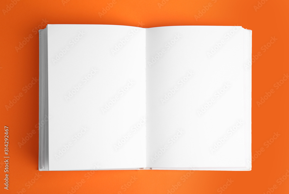Open book with blank pages on orange background - obrazy, fototapety, plakaty 