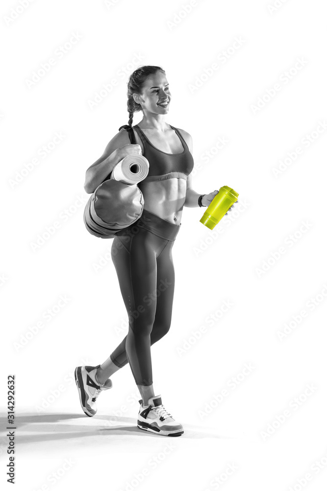 Sport backgrounds. Beautiful slim sporty young girl is preparing for joint training. Fitness concept. Sport backgrounds. Beautiful slim sporty young girl is preparing for joint training. Fitness concept.
