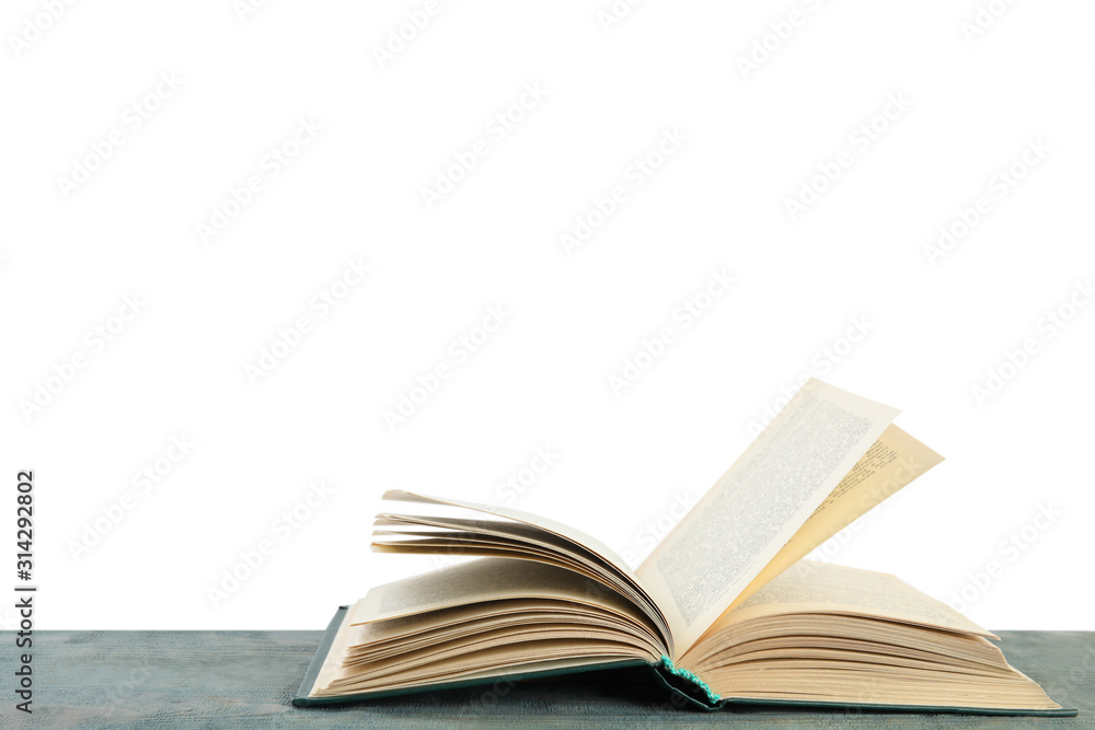 Open old hardcover book on wooden table Open old hardcover book on wooden table