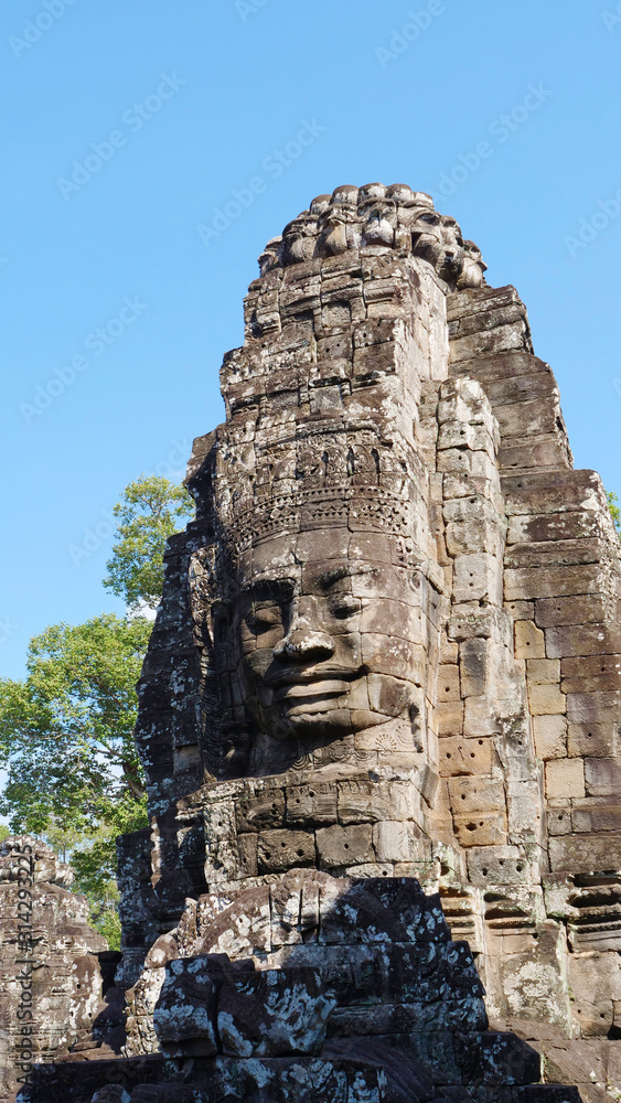 Face tower at the Bayon Temple in Angkor wat complex, Siem Reap Cambodia