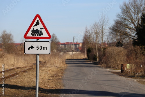 Fotografie Railway level crossing ahead warning signs