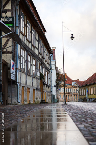 Fototapeta Naklejka Na Ścianę i Meble -  Beautiful small citybrick road, path street with interesting, old architecture.
