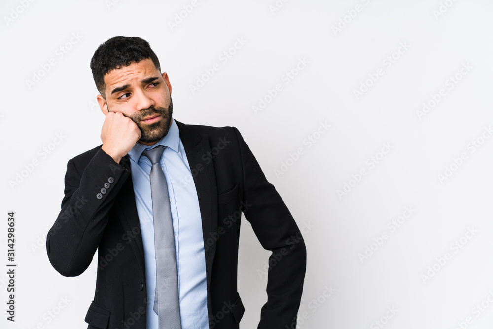 Young latin business woman against a white background isolated who feels sad and pensive, looking at copy space. Young latin business woman against a white background isolated who feels sad and pensive, looking at copy space.