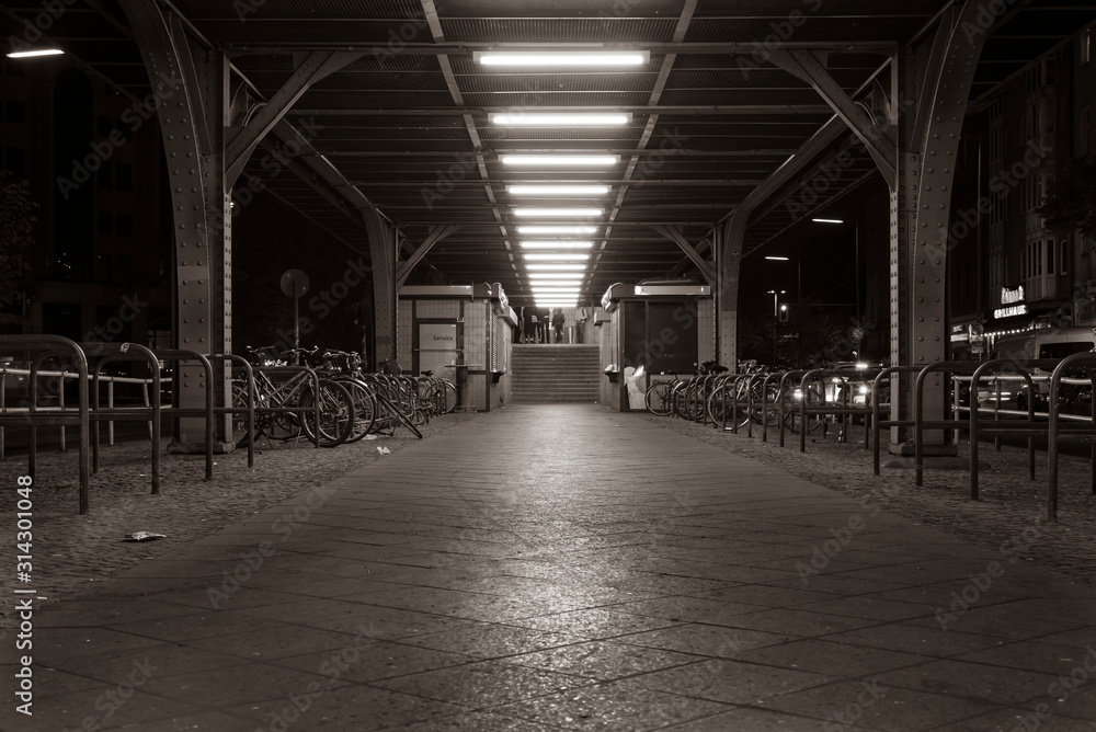 Stairs to the platform of a subway station in Berlin, entrance to the subway station Görlitzer Strasse in Berlin Kreuzberg, night shot, Berlin, Germany, black and white photo, sepia photo