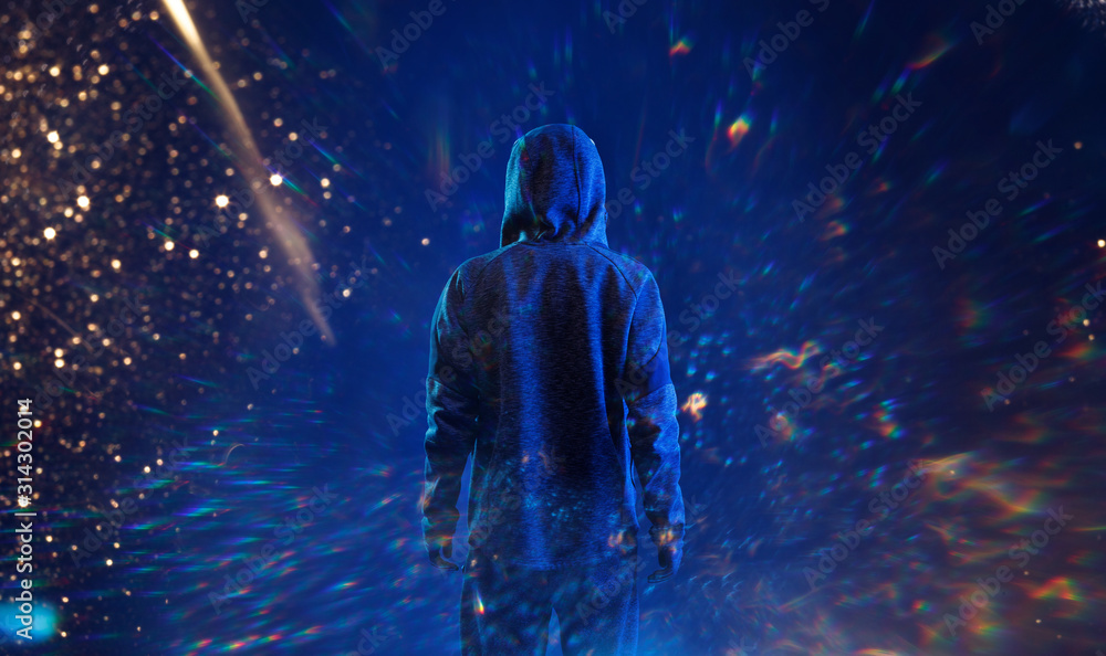 Back view of hacker in hoodie. Dangerous hooded hacker. Internet, cyber crime, cyber attack, system breaking and malware concept. Anonymous. Dark background. Blue neon light, golden sparkles. Back view of hacker in hoodie. Dangerous hooded hacker. Internet, cyber crime, cyber attack, system breaking and malware concept. Anonymous. Dark background. Blue neon light, golden sparkles.