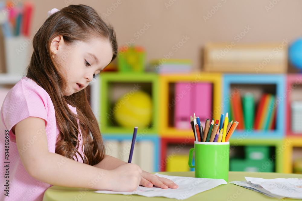 Cute little girl in pink shirt drawing Cute little girl in pink shirt drawing