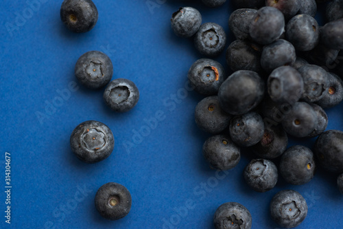 Blueberry berry on a classic blue background.