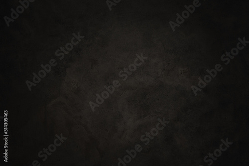Black concrete textured wall background.black cement wall texture for interior design. dark edges.copy space for add text.