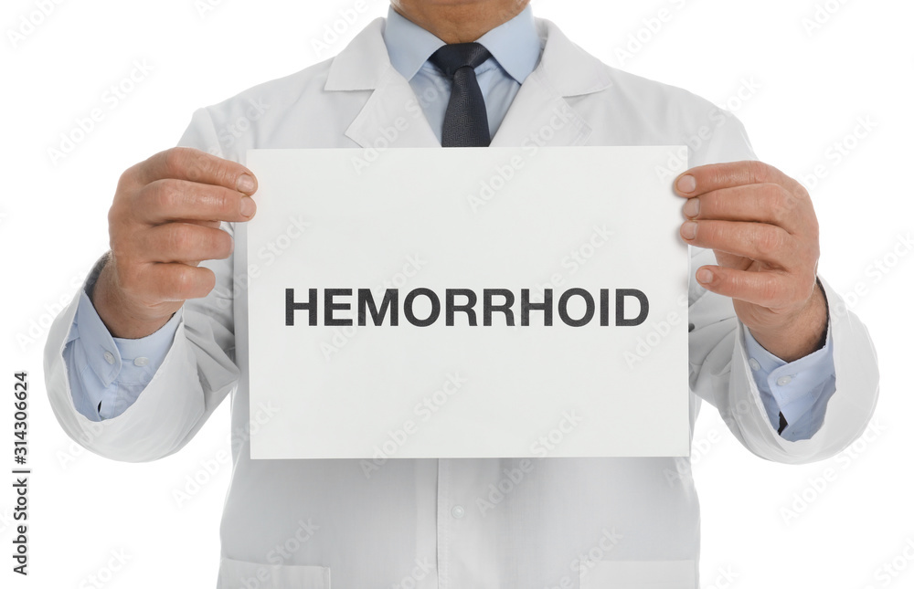 Doctor holding sign with word HEMORRHOID on white background, closeup Doctor holding sign with word HEMORRHOID on white background, closeup