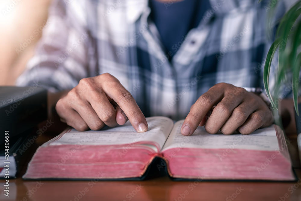 Man studying the Bible in Sunday, Christian concept. Man studying the Bible in Sunday, Christian concept.