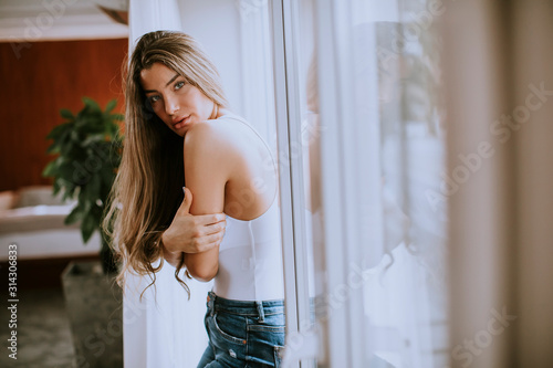 Young woman standing by the...