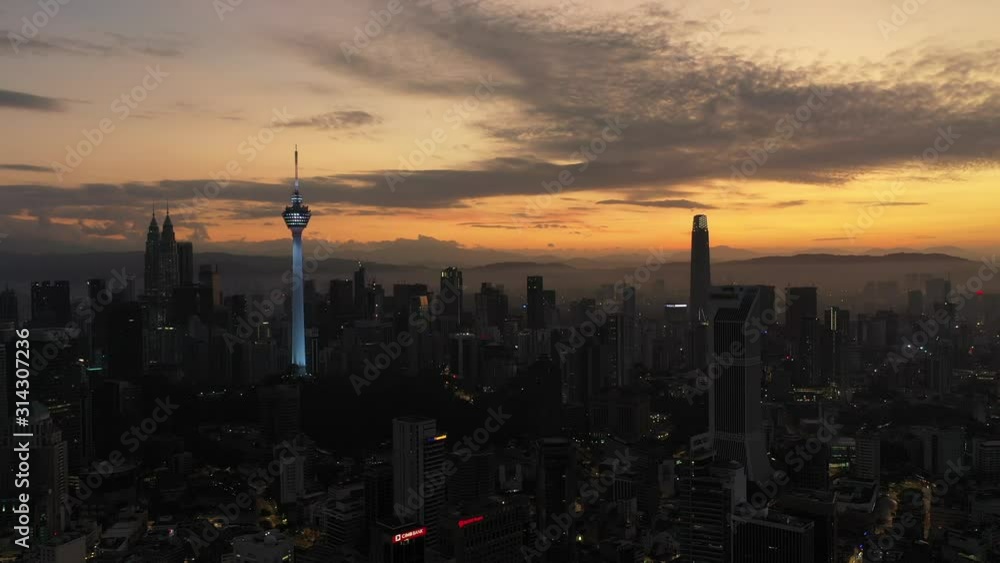 Aerial cinematic drone b-roll shot of sunrise at Kuala Lumpur city skyline. Aerial cinematic drone b-roll shot of sunrise at Kuala Lumpur city skyline.