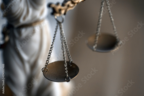 Symbol of law and justice on wooden table in lawyer office © Aerial Mike