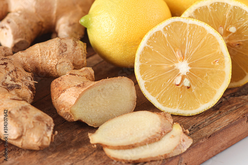 Ginger and lemon on wooden board