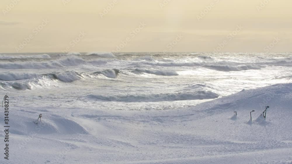 in Kamchatka, strong waves raging in the Pacific ocean in winter in daylight in Kamchatka, strong waves raging in the Pacific ocean in winter in daylight