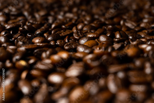 Close up of fresh roasted brown coffee beans - angled view