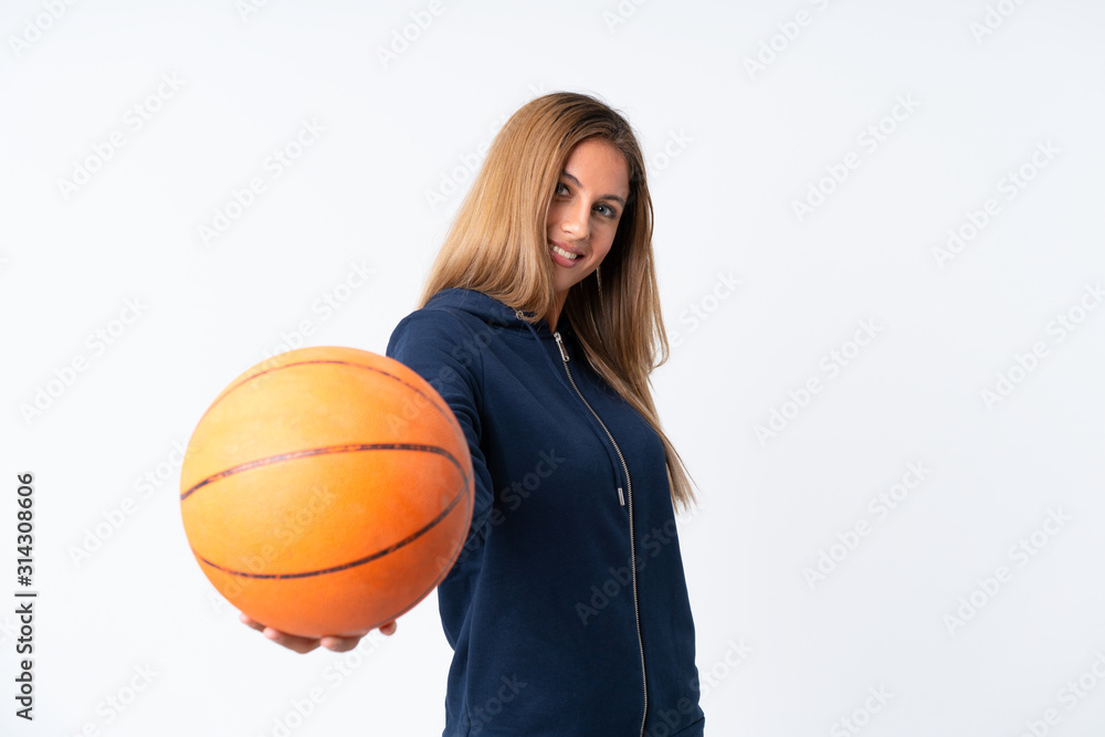 Young woman playing basketball over isolated white background Young woman playing basketball over isolated white background